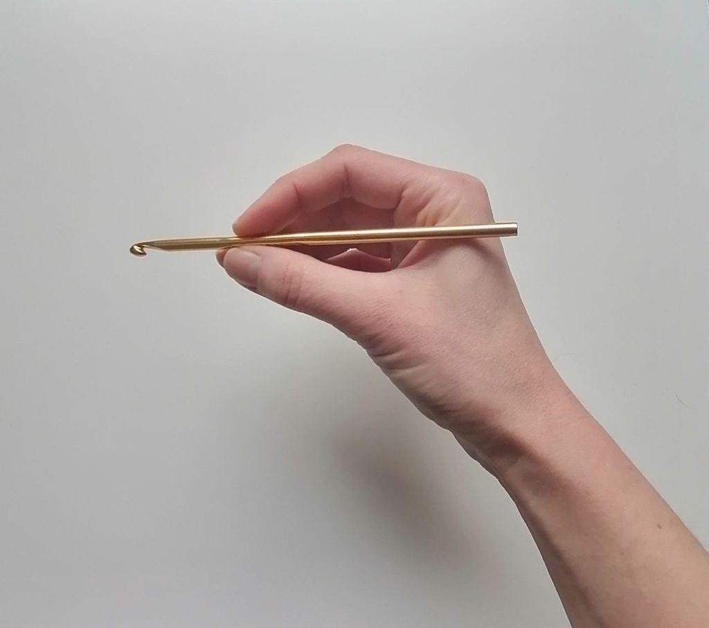 držení háčku tužka
